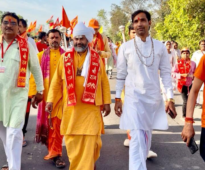 Shri Pradeep Maharaj Ji smiling during a spiritual gathering
